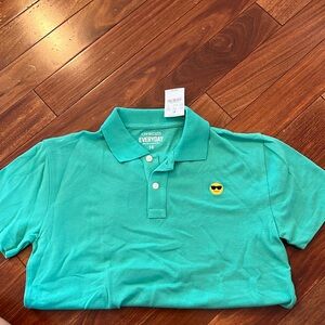 Kids Crewcuts teal polo with smile with sunglasses logo. Never worn.